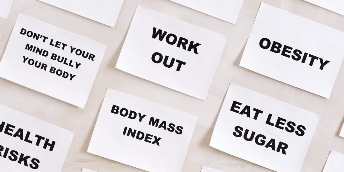Flat lay of motivational health quotes on paper, promoting healthy habits and self-care.
