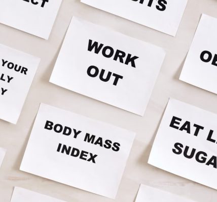 Flat lay of motivational health quotes on paper, promoting healthy habits and self-care.