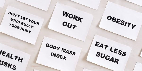 Flat lay of motivational health quotes on paper, promoting healthy habits and self-care.